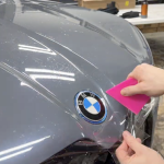 Beyond Auto Protection Vancouver Technician installing paint protection film on BMW